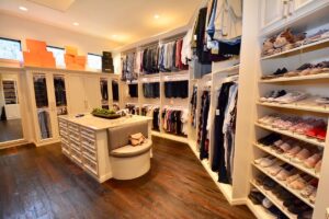 Walk-in closet with white shelving