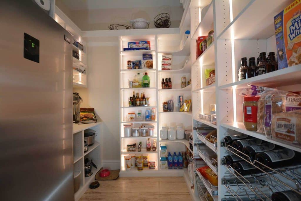 Closet with shelves and lighting